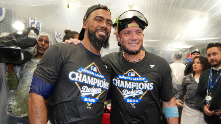 Oct 17, 2025; Los Angeles, California, USA; Los Angeles Dodgers right fielder Teoscar Hernandez (37) and second baseman Miguel Rojas (72) celebrate in the clubhouse after defeating the Milwaukee Brewers in game four of the NLCS round for the 2025 MLB playoffs at Dodger Stadium. Mandatory Credit: Kirby Lee-Imagn Images Oct 17, 2025; Los Angeles, California, USA; Los Angeles Dodgers right fielder Teoscar Hernandez (37) and second baseman Miguel Rojas (72) celebrate in the clubhouse after defeating the Milwaukee Brewers in game four of the NLCS round for the 2025 MLB playoffs at Dodger Stadium. Mandatory Credit: Kirby Lee-Imagn Images