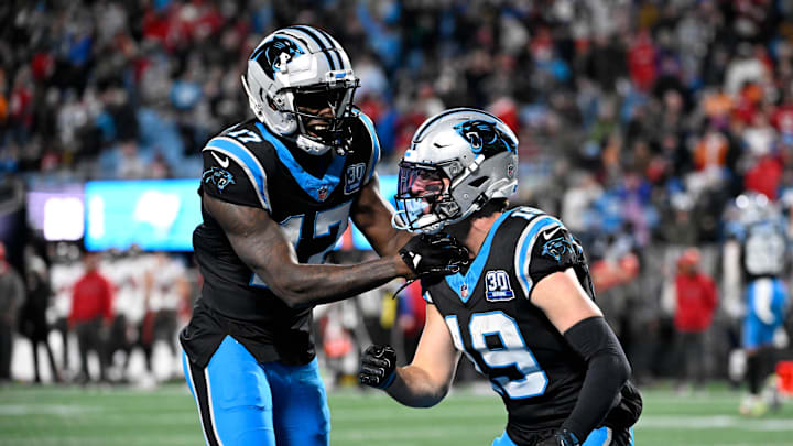Dec 1, 2024; Charlotte, North Carolina, USA; Carolina Panthers wide receiver Adam Thielen (19) celebrates with wide receiver Xavier Legette (17) after scoring. a touchdown to take the lead with 30 seconds left in the fourth quarter at Bank of America Stadium. Mandatory Credit: Bob Donnan-Imagn Images