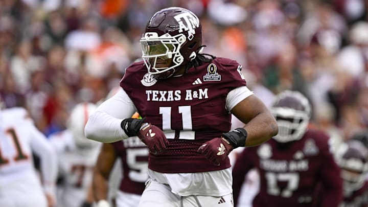 Dec 20, 2025; College Station, TX, USA; Texas A&M Aggies defensive tackle Tyler Onyedim (11) celebrates during the game between the Aggies and the Hurricanes at Kyle Field. Mandatory Credit: Jerome Miron-Imagn Images