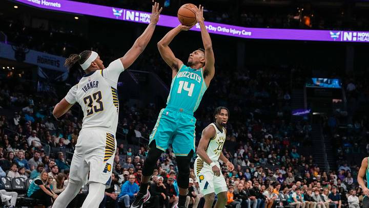 Feb 4, 2024; Charlotte, North Carolina, USA; Charlotte Hornets guard Ish Smith (14) shoots over Indiana Pacers center Myles Turner (33) during the first quarter at Spectrum Center. Mandatory Credit: Jim Dedmon-USA TODAY Sports Feb 4, 2024; Charlotte, North Carolina, USA; Charlotte Hornets guard Ish Smith (14) shoots over Indiana Pacers center Myles Turner (33) during the first quarter at Spectrum Center. Mandatory Credit: Jim Dedmon-USA TODAY Sports