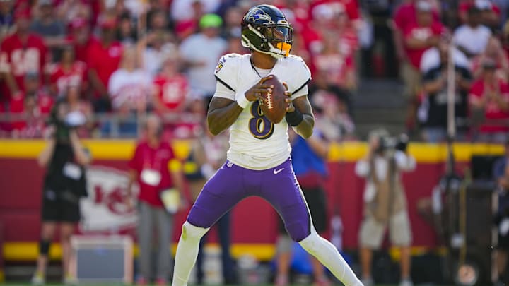 Sep 28, 2025; Kansas City, Missouri, USA; Baltimore Ravens quarterback Lamar Jackson (8) drops back to pass during the first half against the Kansas City Chiefs at GEHA Field at Arrowhead Stadium. Mandatory Credit: Jay Biggerstaff-Imagn Images