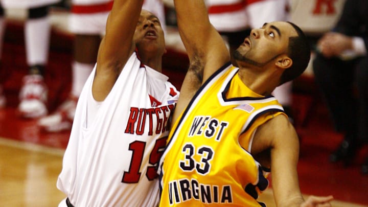 Jan 31, 2007; Piscataway, NJ, USA; West Virginia Mountaineers center Rob Summers (33) and Rutgers Scarlet Knights forward Jr Inman (15) during opening game tip off at the Louis Brown Athletic Center. West Virginia won 89-83. 