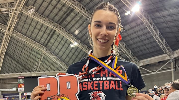 Abby Mecklenburg of Linn-Mar became the first Iowa high school girl to surpass 20 feet in the long jump.