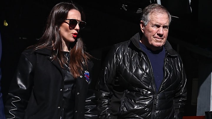 Oct 26, 2024; East Rutherford, New Jersey, USA; Former New England Patriots head coach Bill Belichick and girlfriend Jordon Hudson enter the field before the game between the Notre Dame Fighting Irish and the Navy Midshipmen at MetLife Stadium. Mandatory Credit: Vincent Carchietta-Imagn Images