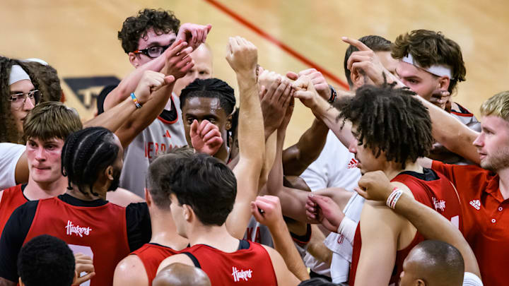 Both Red and White teams meet at center court at the end of the scrimmage. 