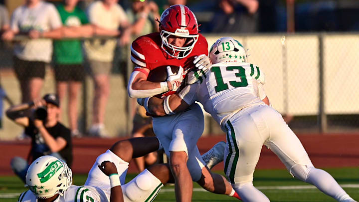 Wall linebacker Jacob Braden tackles Jim Ned running back Aiden Ellis.