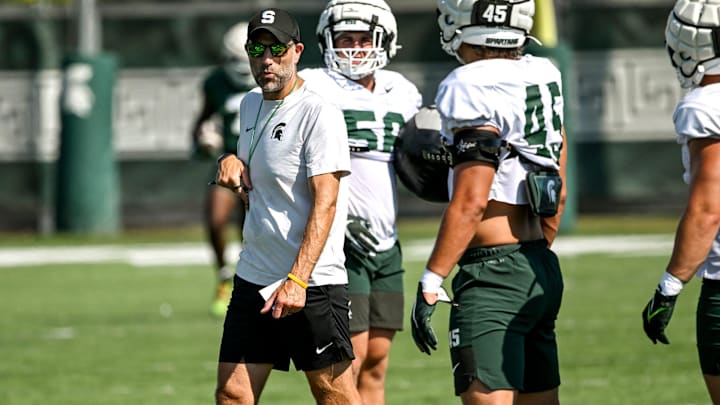Michigan State's defensive coordinator Joe Rossi talks with the linebackers during football practice on Monday, Aug. 11, 2025, in East Lansing.