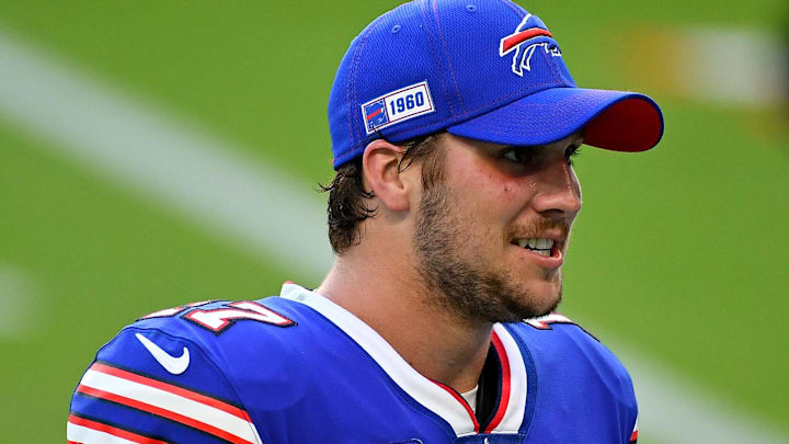 Buffalo Bills quarterback Josh Allen (17) reacts while walking off the field after defeating the Miami Dolphins.
