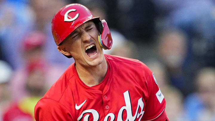 May 28, 2025; Kansas City, Missouri, USA; Cincinnati Reds designated hitter Austin Hays (12) reacts after fouling a ball off of his leg during the sixth inning against the Kansas City Royals at Kauffman Stadium. Mandatory Credit: Jay Biggerstaff-Imagn Images