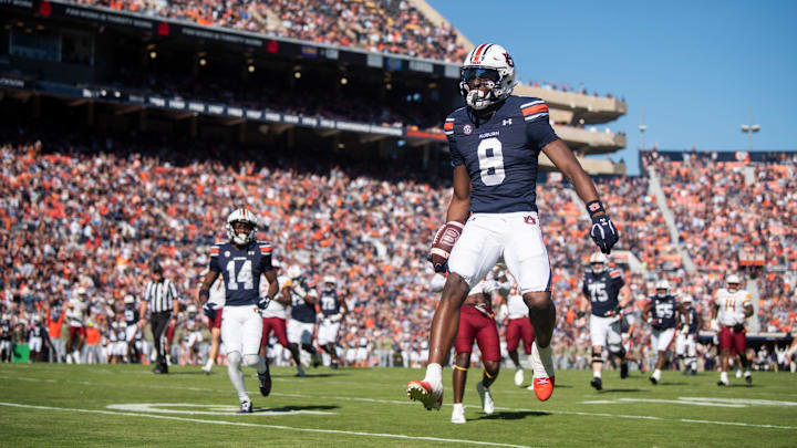 Auburn Tigers wide receiver Cam Coleman (8) jumps into the end zone for a touchdown after a catch as Auburn Tigers take on Louisiana-Monroe Warhawks at Jordan-Hare Stadium in Auburn, Ala., on Saturday, Nov. 16, 2024.