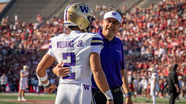Demond Williams Jr. and Jedd Fisch share an Apple Cup moment.