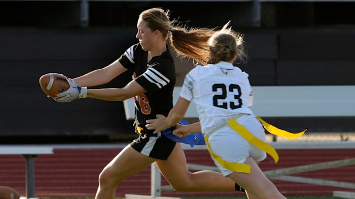 Spruce Creek's Jillian Truax reaches for extra yardage during the District 5-2A Flag Football Championship game against New Smyrna Beach last year. Last week, she passed for 277 yards and two TDs, rushed for 48 yards and made three tackles to guide the Hawks past University High (Orange City), 12-0.