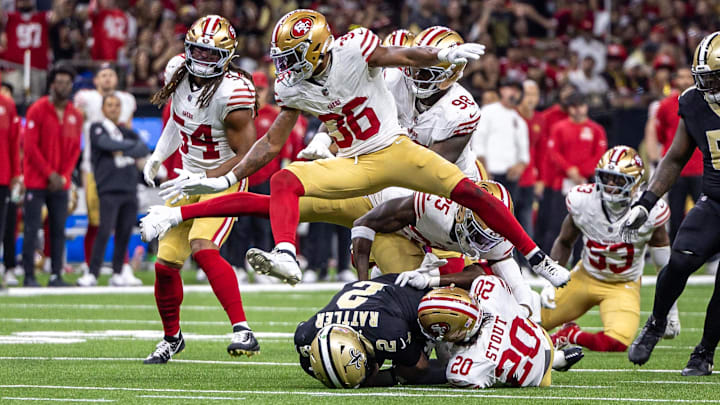 Sep 14, 2025; New Orleans, Louisiana, USA; New Orleans Saints quarterback Spencer Rattler (2) scrambles against San Francisco 49ers cornerback Upton Stout (20) during the first half at Caesars Superdome. Mandatory Credit: Stephen Lew-Imagn Images