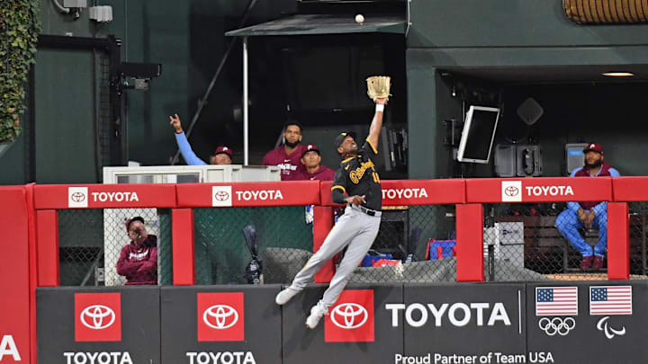 Apr 11, 2024; Philadelphia, Pennsylvania, USA; Pittsburgh Pirates outfielder Michael A. Taylor (18) tries to catch home run hit by Philadelphia Phillies third base Alec Bohm (28) (not pictured) during the fourth inning at Citizens Bank Park. Mandatory Credit: Eric Hartline-USA TODAY Sports