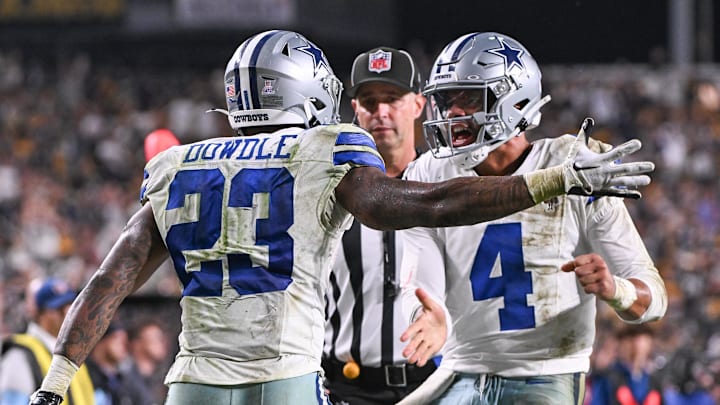 Dallas Cowboys running back Rico Dowdle (23) celebrates a touchdown with quarterback Dak Prescott.