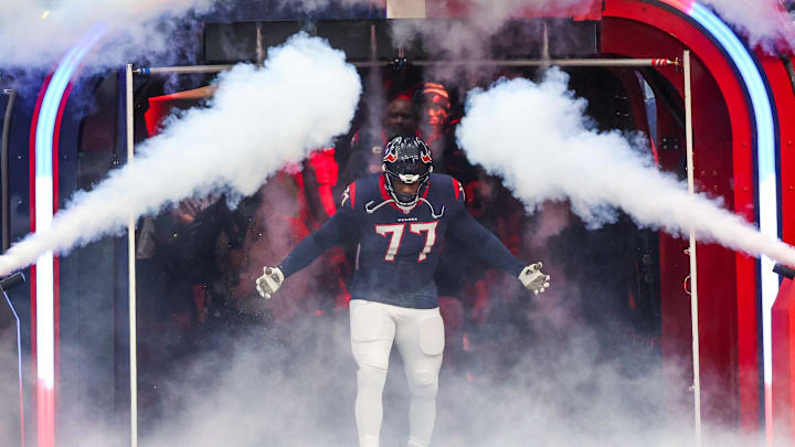Dec 3, 2023; Houston, Texas, USA;Houston Texans offensive tackle George Fant (77)  is introduced before playing against the Denver Broncos at NRG Stadium. Mandatory Credit: Thomas Shea-Imagn Images