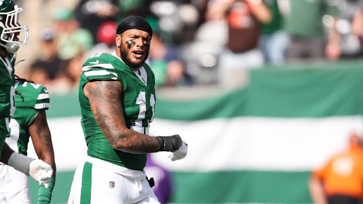 Oct 19, 2025; East Rutherford, New Jersey, USA; New York Jets linebacker Jermaine Johnson (11) celebrates a defensive stop in the first quarter against the Carolina Panthers at MetLife Stadium. Mandatory Credit: Vincent Carchietta-Imagn Images