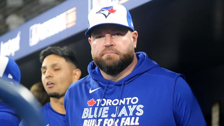Oct 12, 2025; Toronto, Ontario, CAN; Toronto Blue Jays manager John Schneider (14) looks on before game one against the Seattle Mariners in the ALCS round for the 2025 MLB playoffs at Rogers Centre. 