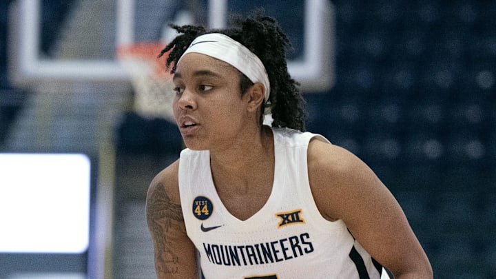 Dec 1, 2024; Estero, FL, USA; West Virginia University Sydney Shaw (5) looks to make a pass in the first quarter of the Women's Gulf Coast Showcase at Hertz Arena. Mandatory Credit: Chris Tilley-Imagn Images