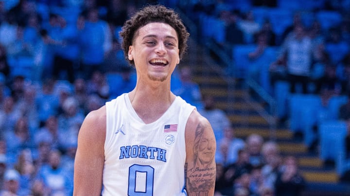 Dec 16, 2025; Chapel Hill, North Carolina, USA; North Carolina Tar Heels guard Kyan Evans (0) celebrates during the second half against the ETSU Buccaneers at Dean E. Smith Center. Mandatory Credit: Scott Kinser-Imagn Images