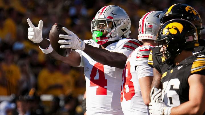 Ohio State Buckeyes wide receiver Jeremiah Smith (4) reacts to a first down catch during the NCAA football game against the Iowa Hawkeyes at Kinnick Stadium in Iowa City on Oct. 3, 2026. Ohio State Buckeyes wide receiver Jeremiah Smith (4) reacts to a first down catch during the NCAA football game against the Iowa Hawkeyes at Kinnick Stadium in Iowa City on Oct. 3, 2026.