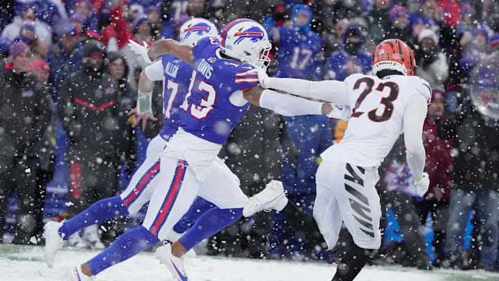 Buffalo Bills quarterback Josh Allenruns for 40-yards for a touchdown with wide receiver Gabe Davis keeping pace with him and blocking Cincinnati Bengals cornerback Dax Hill during second half action at Highmark Stadium in Orchard Park on Dec. 7, 2025.