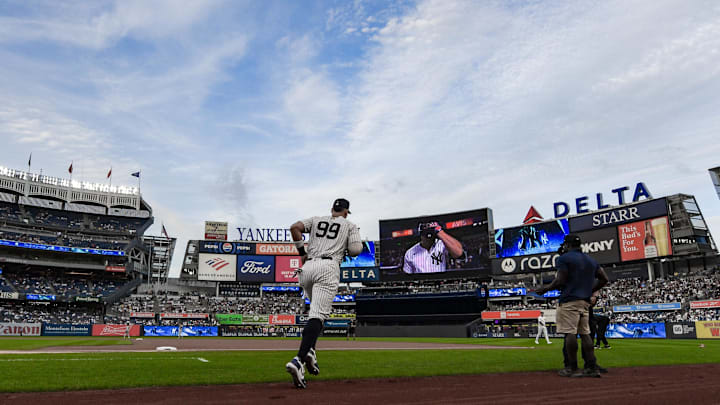 Aug 24, 2025; Bronx, New York, USA; New York Yankees outfielder Aaron Judge (99) enters the field for pregame warmups before the game against the Boston Red Sox at Yankee Stadium. Mandatory Credit: John Jones-Imagn Images