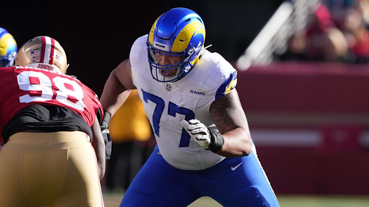 Jan 7, 2024; Santa Clara, California, USA; Los Angeles Rams offensive tackle Alaric Jackson (77) blocks San Francisco 49ers defensive tackle Javon Hargrave (98) during the first quarter at Levi's Stadium. Mandatory Credit: Darren Yamashita-Imagn Images