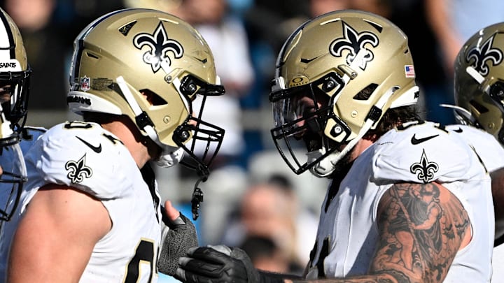 New Orleans Saints tight end Foster Moreau (87) celebrates with center Connor McGovern (61) after scoring a touchdown