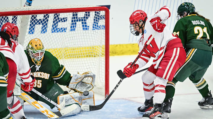Clarkson goaltender Holly Gruber (35) stops a shot by Wisconsin right wing Kirsten Simms (27) in the second period of an NCAA regional final March 15, 2025, at LaBahn Arena in Madison, Wisconsin.