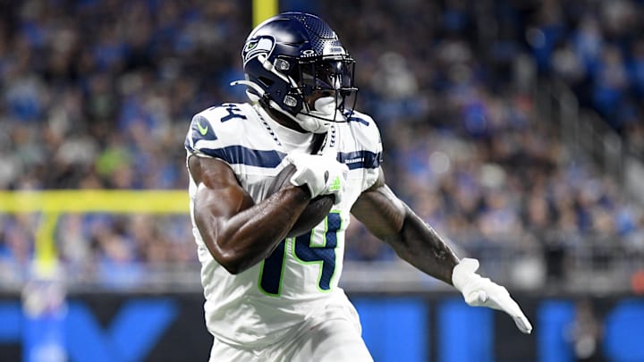 Sep 30, 2024; Detroit, Michigan, USA; Seattle Seahawks wide receiver DK Metcalf (14) runs with the ball against the Detroit Lions in the second quarter at Ford Field. Mandatory Credit: Eamon Horwedel-Imagn Images