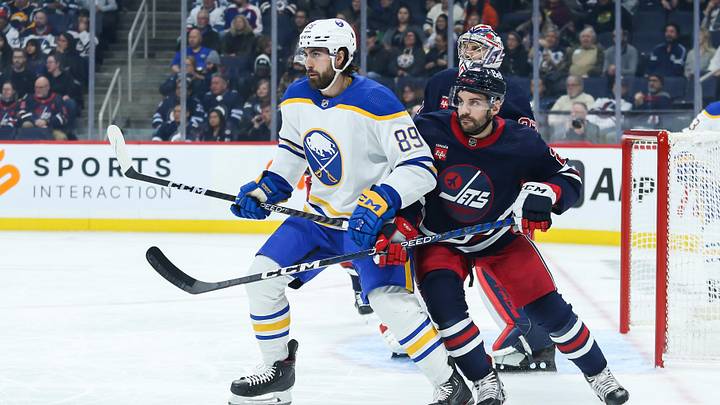 Jan 26, 2023; Winnipeg, Manitoba, CAN; Buffalo Sabres forward Alex Tuch (89) jostles for position with Winnipeg Jets defenseman Dylan DeMelo (2) in front of Winnipeg Jets goalie Connor Hellebuyck (37) during the first period at Canada Life Centre. Mandatory Credit: Terrence Lee-Imagn Images Jan 26, 2023; Winnipeg, Manitoba, CAN; Buffalo Sabres forward Alex Tuch (89) jostles for position with Winnipeg Jets defenseman Dylan DeMelo (2) in front of Winnipeg Jets goalie Connor Hellebuyck (37) during the first period at Canada Life Centre. Mandatory Credit: Terrence Lee-Imagn Images