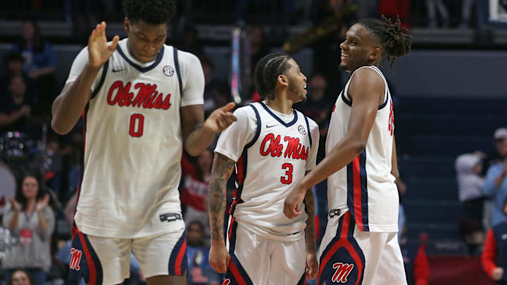 Former Husky guard Koren Johnson (3), now with Ole Miss, celebrates with his teammates. 
