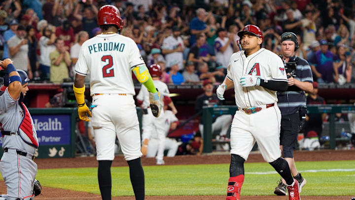 May 31, 2025; Phoenix, Arizona, USA; Arizona Diamondbacks infielder Josh Naylor (22) and infielder Geraldo Perdomo (2) celebrate after a home run by Naylor in the bottom of the fourth against the Washington Nationals at Chase Field. Mandatory Credit: Allan Henry-Imagn Images May 31, 2025; Phoenix, Arizona, USA; Arizona Diamondbacks infielder Josh Naylor (22) and infielder Geraldo Perdomo (2) celebrate after a home run by Naylor in the bottom of the fourth against the Washington Nationals at Chase Field. Mandatory Credit: Allan Henry-Imagn Images