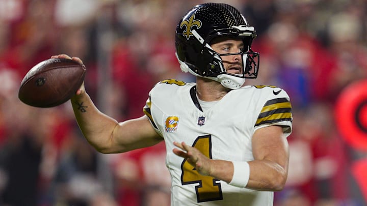 Oct 7, 2024; Kansas City, Missouri, USA; New Orleans Saints quarterback Derek Carr (4) throws a pass during the first half against the Kansas City Chiefs at GEHA Field at Arrowhead Stadium. 