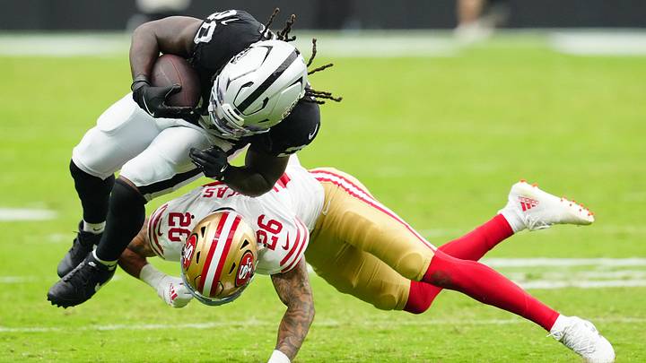 Las Vegas Raiders running back Sincere McCormick (28) is tackled by San Francisco 49ers cornerback Chase Lucas (26)