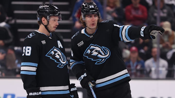 Oct 21, 2025; Salt Lake City, Utah, USA; Utah Mammoth defenseman Mikhail Sergachev (98) and defenseman Dmitri Simashev (26) speak before a game against the Colorado Avalanche at Delta Center. Mandatory Credit: Rob Gray-Imagn Images