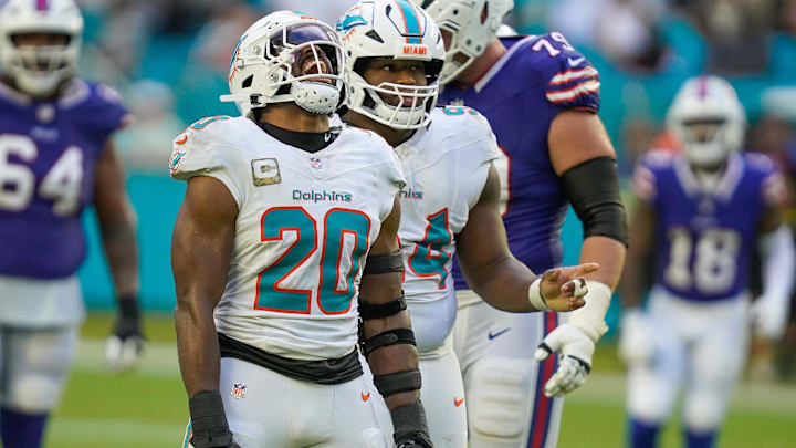 Miami Dolphins linebacker Jordyn Brooks (20) and defensive tackle Jordan Phillips (94) celebrate a fourth down stop against the Buffalo Bills during the fourth quarter at Hard Rock Stadium last season.