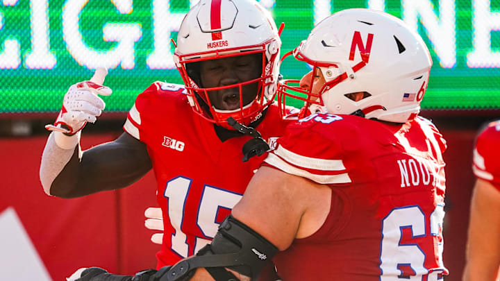 Nebraska wide receiver Malachi Coleman and offensive lineman Nouredin Nouili celebrate after a touchdown by Coleman against Northwestern in 2023. 