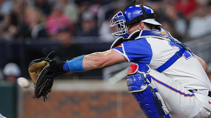 Sep 6, 2025; Cumberland, Georgia, USA; Atlanta Braves catcher Sean Murphy (12) makes a catch during the game against the Seattle Mariners during the seventh inning at Truist Park. Mandatory Credit: Jordan Godfree-Imagn Images