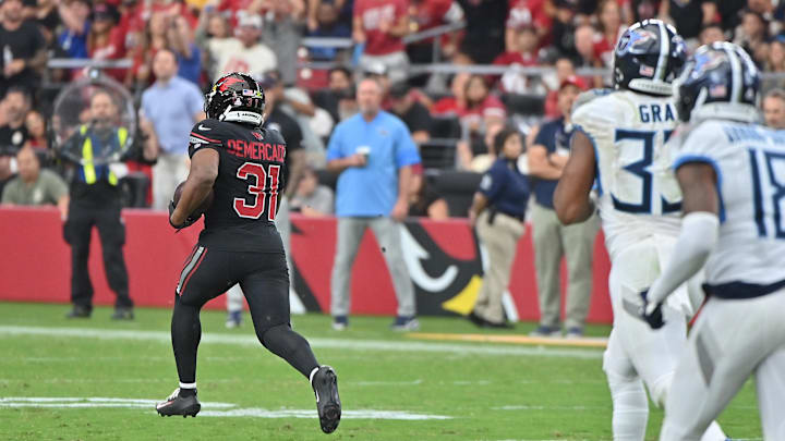 Oct 5, 2025; Glendale, Arizona, USA; Arizona Cardinals running back Emari Demercado (31) runs the ball for 71 yards before fumbling against the Tennessee Titans during the fourth quarter at State Farm Stadium. Mandatory Credit: Matt Kartozian-Imagn Images Oct 5, 2025; Glendale, Arizona, USA; Arizona Cardinals running back Emari Demercado (31) runs the ball for 71 yards before fumbling against the Tennessee Titans during the fourth quarter at State Farm Stadium. Mandatory Credit: Matt Kartozian-Imagn Images