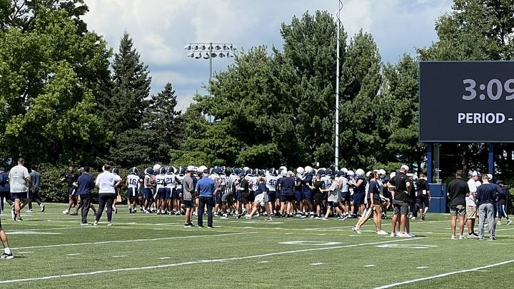 The Penn State Nittany Lions huddle during Day 1 of training camp on the practice fields outside the Lasch Football Building. The Penn State Nittany Lions huddle during Day 1 of training camp on the practice fields outside the Lasch Football Building.
