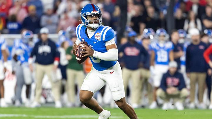 Jan 8, 2026; Glendale, AZ, USA; Detailed view of the jersey of Mississippi Rebels quarterback Trinidad Chambliss (6) against the Miami Hurricanes during the 2026 Fiesta Bowl and semifinal game of the College Football Playoff at State Farm Stadium. Mandatory Credit: Mark J. Rebilas-Imagn Images Jan 8, 2026; Glendale, AZ, USA; Detailed view of the jersey of Mississippi Rebels quarterback Trinidad Chambliss (6) against the Miami Hurricanes during the 2026 Fiesta Bowl and semifinal game of the College Football Playoff at State Farm Stadium. Mandatory Credit: Mark J. Rebilas-Imagn Images