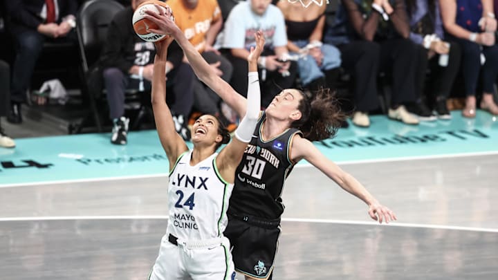 Oct 20, 2024; Brooklyn, New York, USA; Minnesota Lynx forward Napheesa Collier (24) is blocked from behind by New York Liberty forward Breanna Stewart (30) in the third quarter during game five of the 2024 WNBA Finals at Barclays Center. Mandatory Credit: Wendell Cruz-Imagn Images