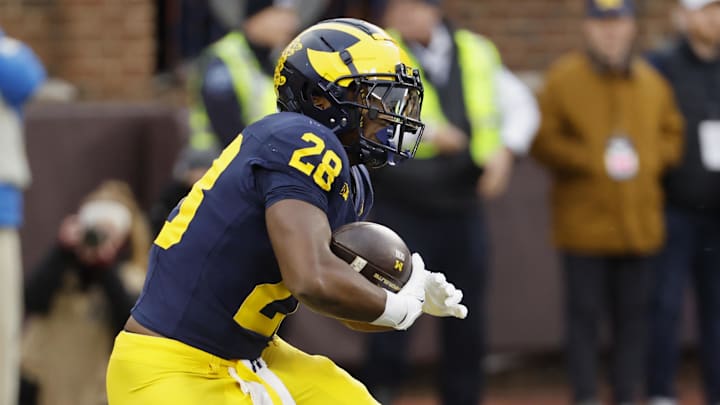 Nov 23, 2024; Ann Arbor, Michigan, USA;  Michigan Wolverines running back Benjamin Hall (28) runs the ball against the Northwestern Wildcats in the first half at Michigan Stadium.