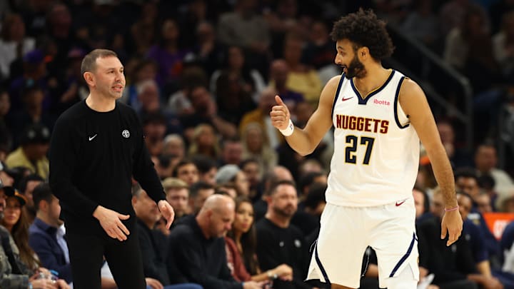 Nov 29, 2025; Phoenix, Arizona, USA; Denver Nuggets head coach David Adelman talks with guard Jamal Murray (27) against the Phoenix Suns in the first half at the Mortgage Matchup Center. Mandatory Credit: Mark J. Rebilas-Imagn Images