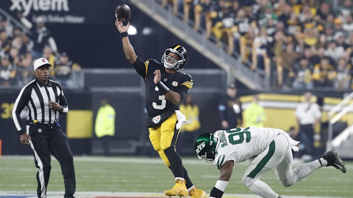 Oct 20, 2024; Pittsburgh, Pennsylvania, USA;  Pittsburgh Steelers quarterback Russell Wilson (3) passes against pressure from New York Jets defensive end Will McDonald IV (99) during the first quarter at Acrisure Stadium. Mandatory Credit: Charles LeClaire-Imagn Images