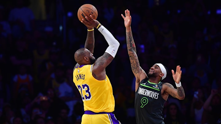 Apr 30, 2025; Los Angeles, California, USA; Los Angeles Lakers forward LeBron James (23) shoots against Minnesota Timberwolves guard Nickeil Alexander-Walker (9) during the second half in game five of first round for the 2025 NBA Playoffs at Crypto.com Arena. Mandatory Credit: Gary A. Vasquez-Imagn Images