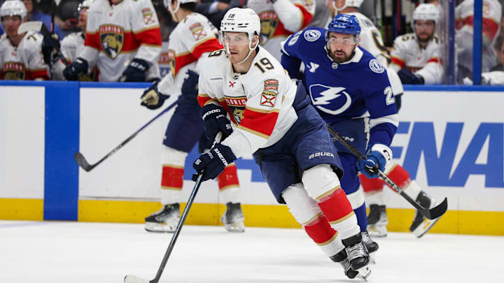 Apr 24, 2025; Tampa, Florida, USA; Florida Panthers left wing Matthew Tkachuk (19) controls the puck against the Tampa Bay Lightning during the third period in game two of the first round of the 2025 Stanley Cup Playoffs at Amalie Arena. Mandatory Credit: Nathan Ray Seebeck-Imagn Images