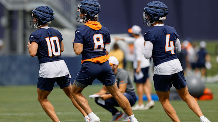 Jul 26, 2024; Englewood, CO, USA; Denver Broncos quarterback Bo Nix (10) and quarterback Jarrett Stidham (8) and quarterback Zach Wilson (4) during training camp at Broncos Park Powered by CommonSpirit. Mandatory Credit: Isaiah J. Downing-Imagn Images Jul 26, 2024; Englewood, CO, USA; Denver Broncos quarterback Bo Nix (10) and quarterback Jarrett Stidham (8) and quarterback Zach Wilson (4) during training camp at Broncos Park Powered by CommonSpirit. Mandatory Credit: Isaiah J. Downing-Imagn Images
